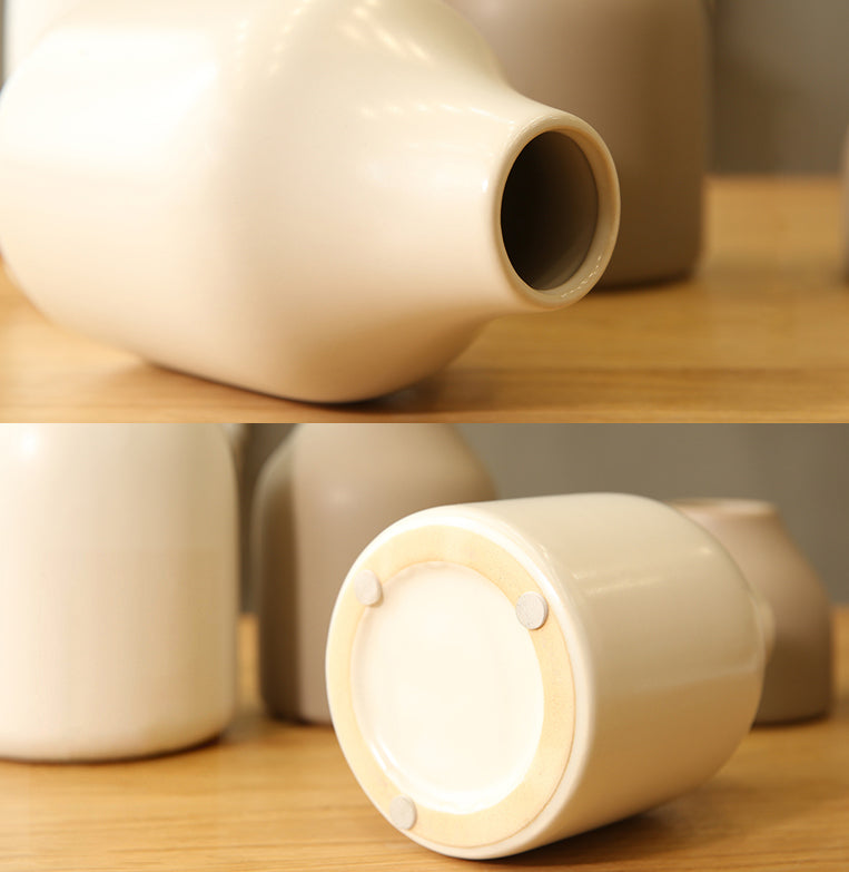 Composizione di fiori artificiali di pesca rosa in vaso grigio - 17.5"