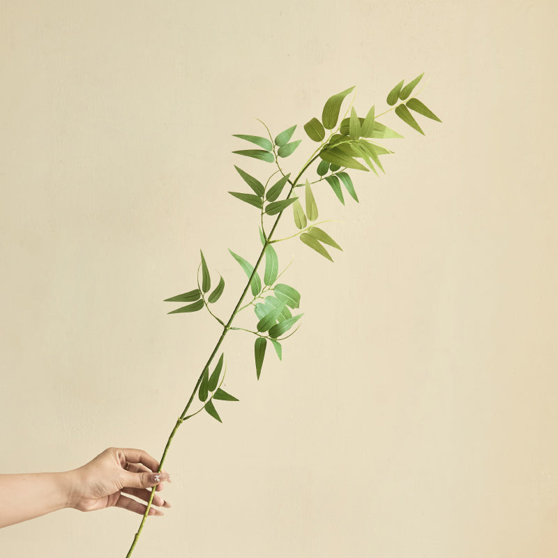Close-up of artificial bamboo leaves showing realistic texture and natural green tones