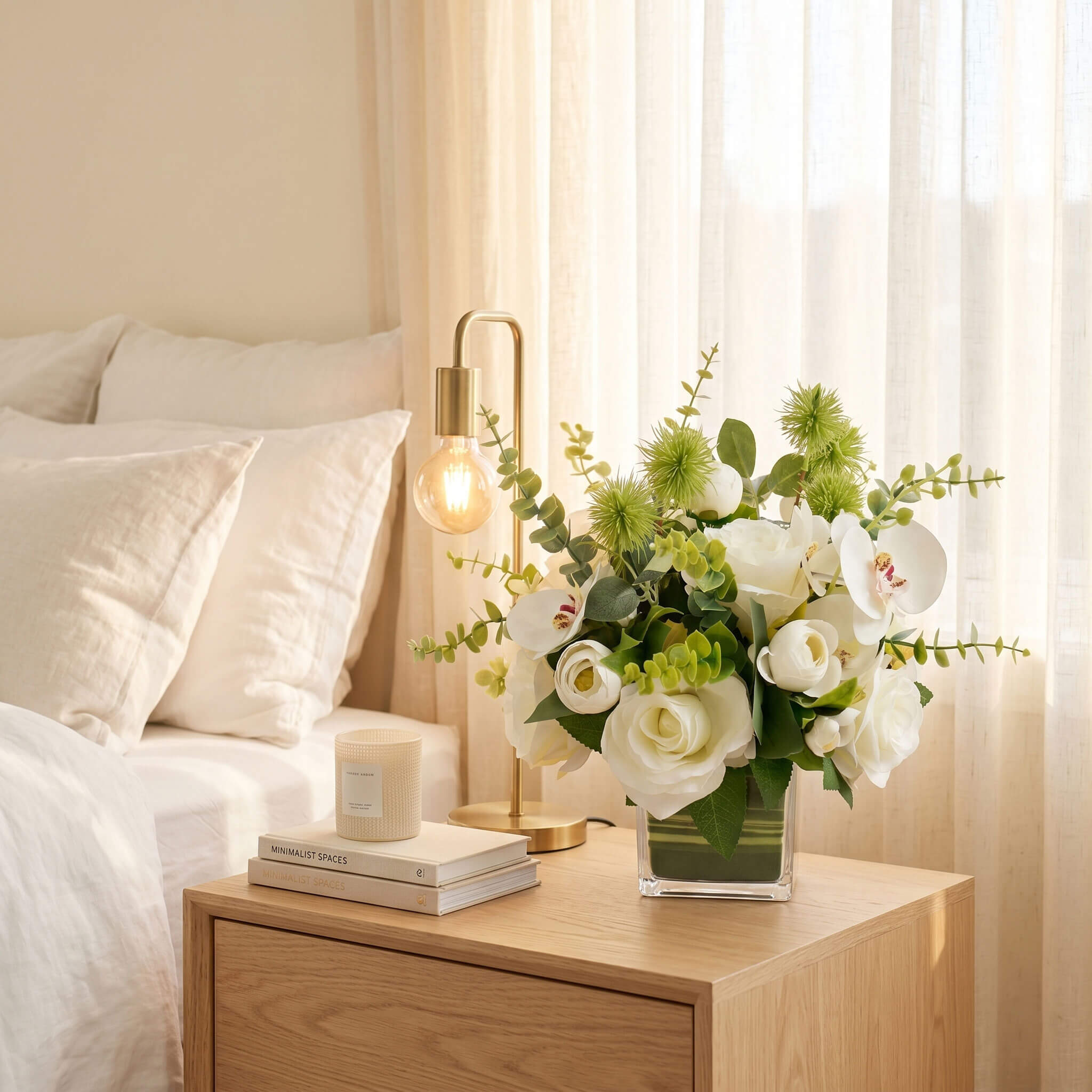 Faux orchid and rose arrangement decorating a bedroom nightstand, bringing a soft botanical touch to a relaxing personal space.