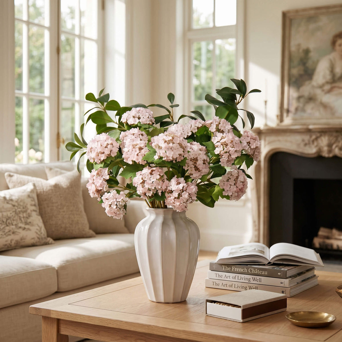 Pink hydrangea arrangement displayed on a living room coffee table, adding a fresh and welcoming focal point to the space.