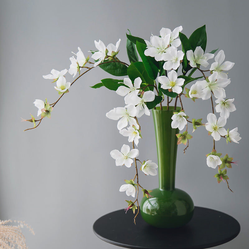 Real touch artificial jasmine arrangement in an olive green long-necked vase, elegant floral decor for modern home interiors.