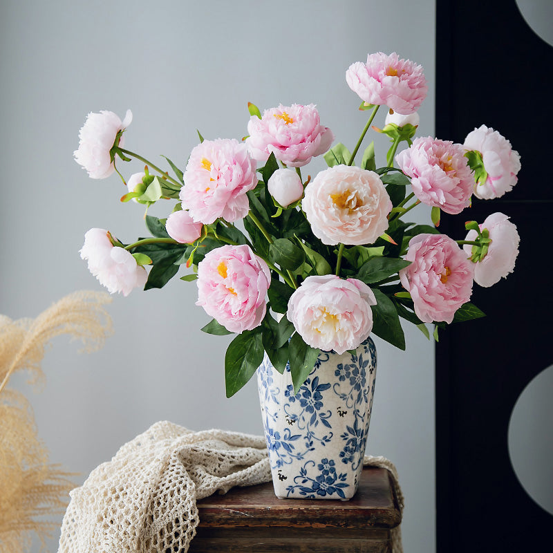 Real touch faux peony arrangement featuring soft pink blooms displayed in a classic blue and white porcelain vase, 20 inches tall