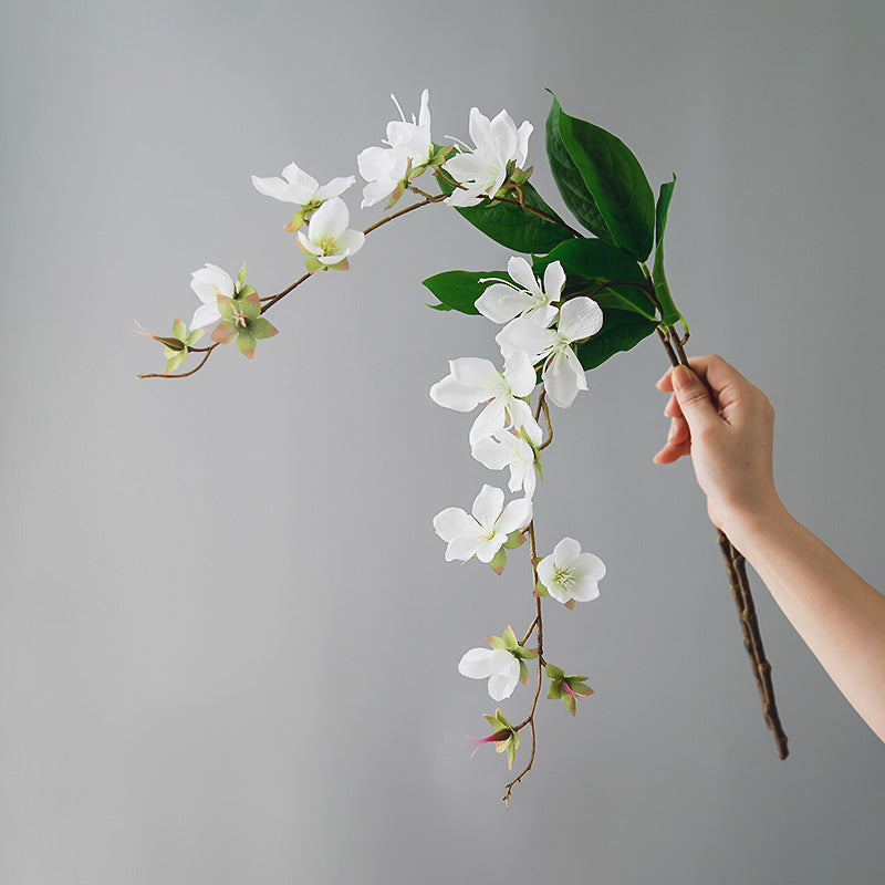 Close-up of real touch artificial jasmine flowers, featuring delicate white petals and a natural-looking floral texture.