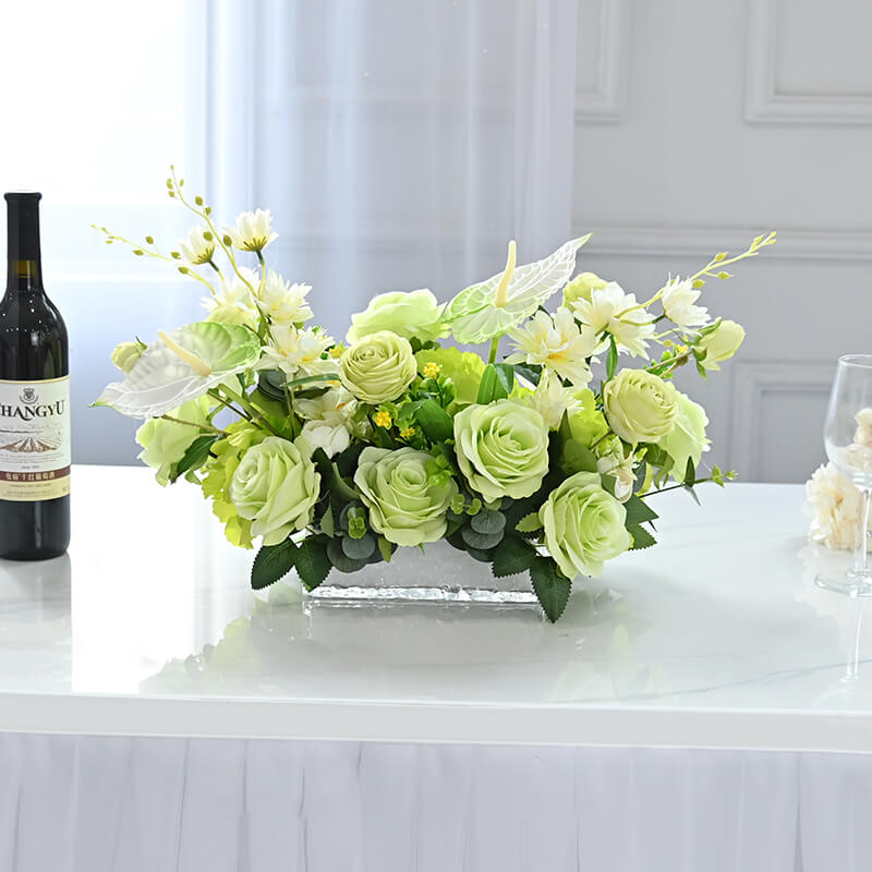Artificial anthurium and rose floral centerpiece with eucalyptus