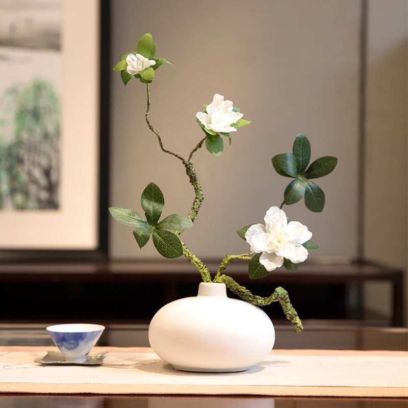 Artificial azalea arrangement in a white oval vase, a compact and elegant floral centerpiece for modern home decor.