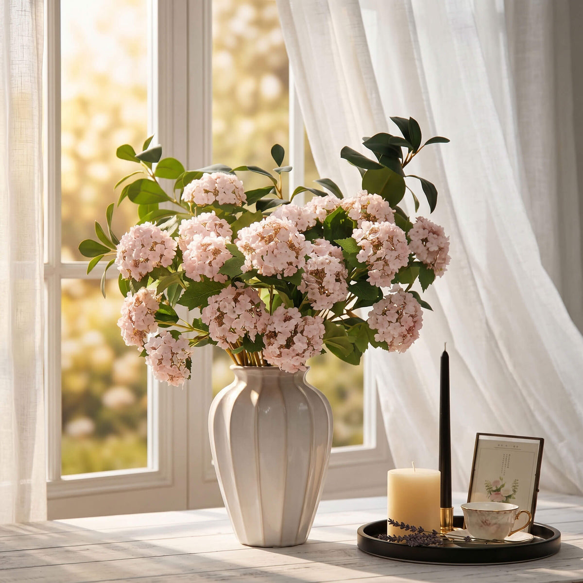 Artificial hydrangea flowers placed by a sunny spring window, bringing seasonal color and natural charm indoors.