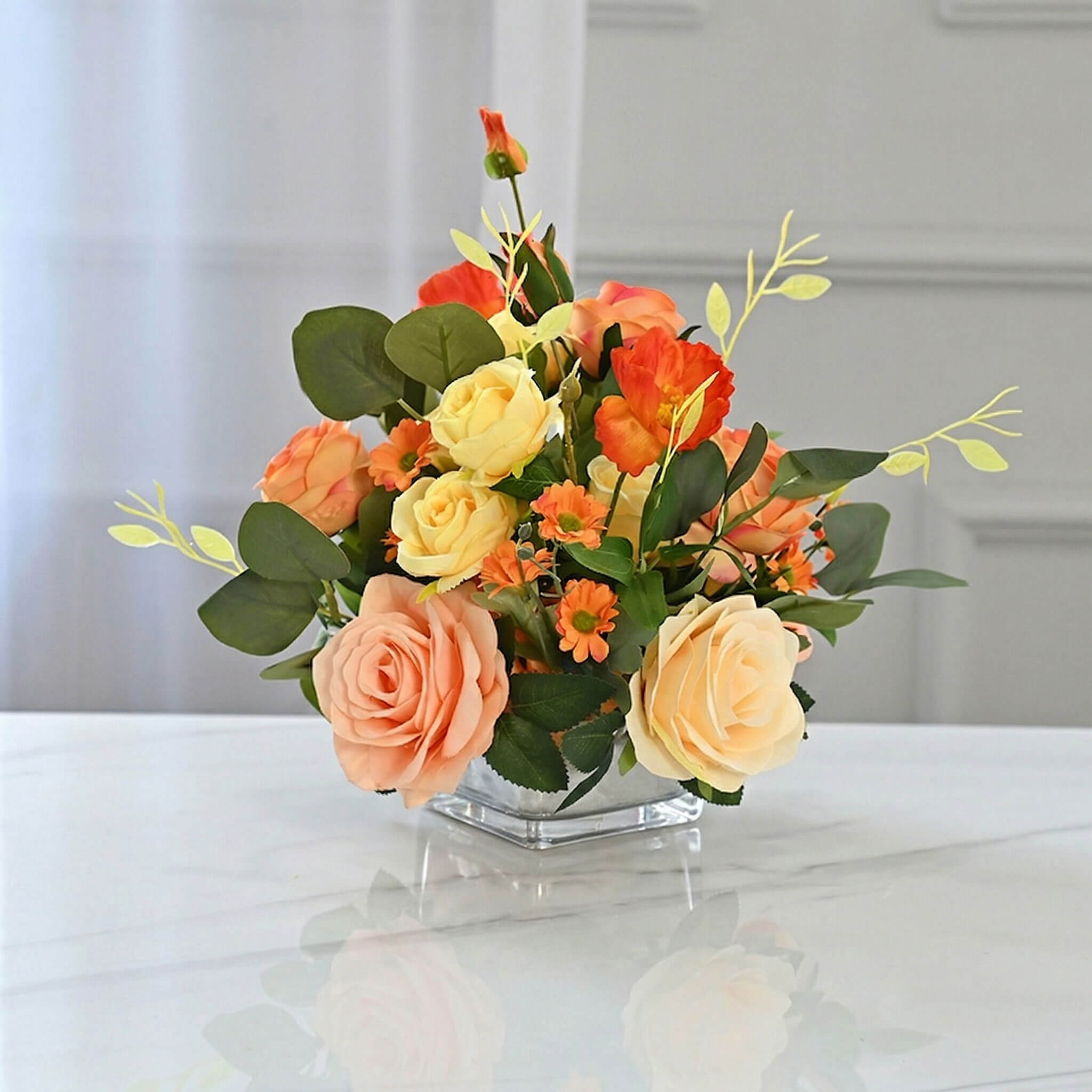 Orange artificial peony and rose floral centerpiece with chrysanthemum