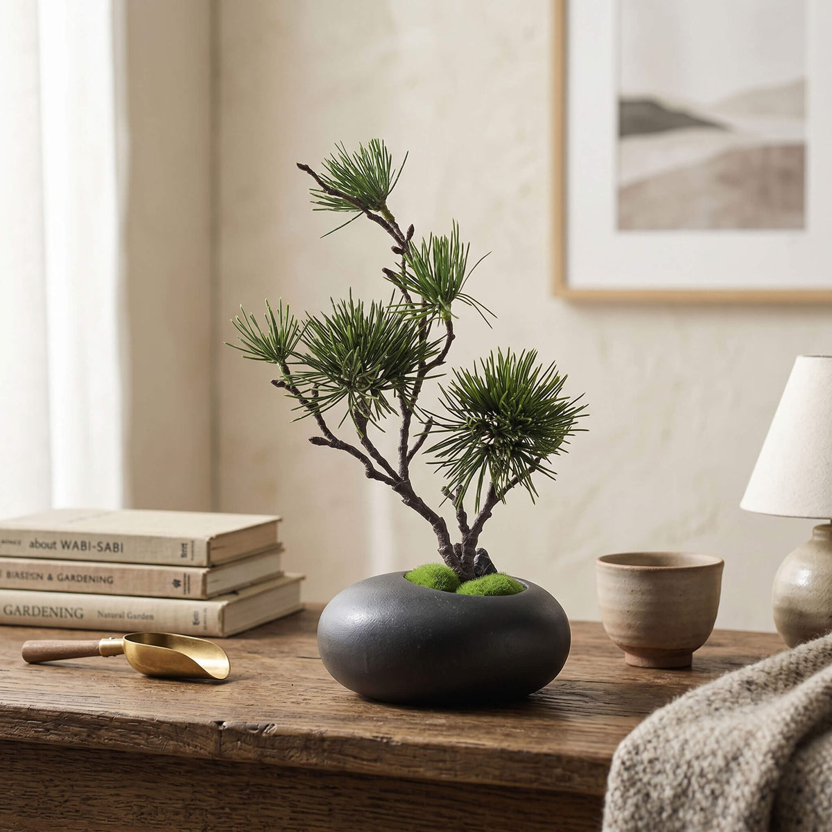 Minimalist faux pine tree arrangement on a console table, ideal for living room decor with a clean modern look.