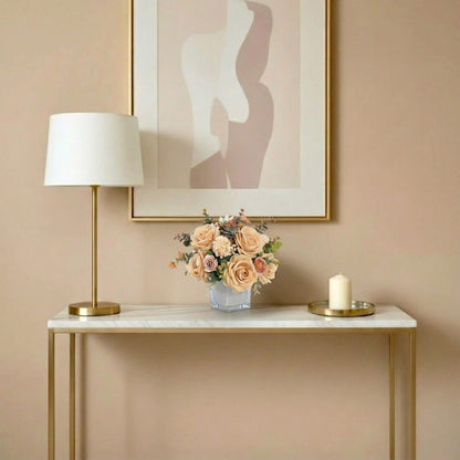 Artificial rose and hydrangea flower arrangement on a living room console table