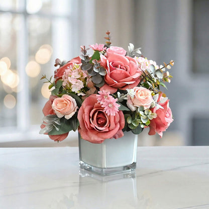 Pink artificial rose and hydrangea flower arrangement with eucalyptus