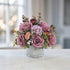 Purple artificial rose and hydrangea floral arrangement with eucalyptus