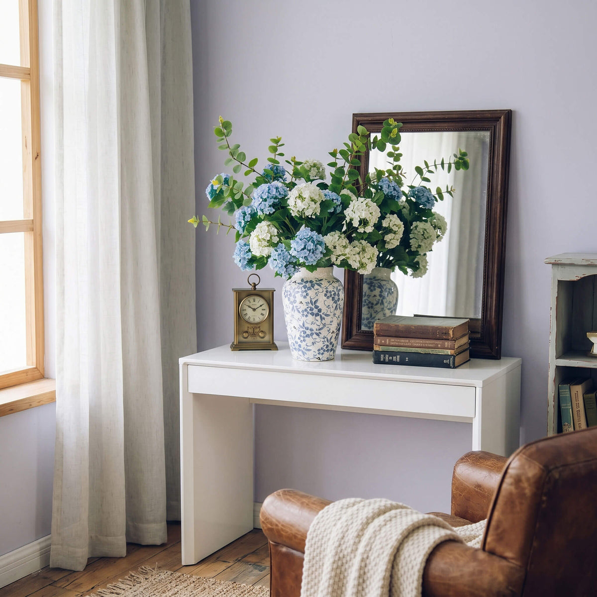 Artificial hydrangea centerpiece placed on a bedroom table, creating a calm and cozy atmosphere.
