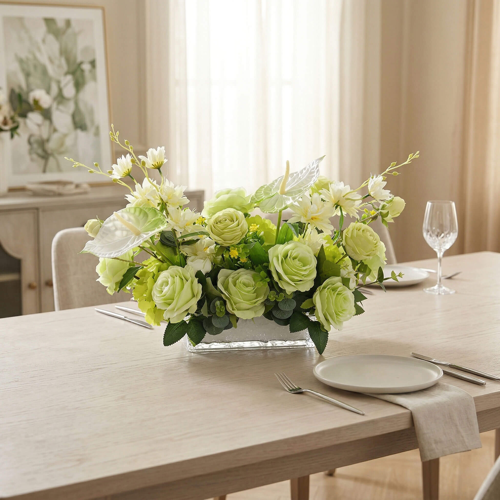 Fake anthurium and rose flower centerpiece with eucalyptus decorating a dining table