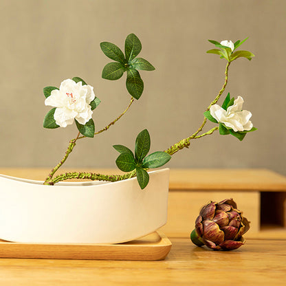 Front view of fake azalea, showing full petals and a naturally layered floral form.