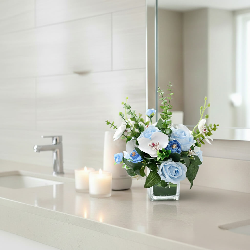 Blue artificial orchid and rose floral arrangement with eucalyptus for bathroom vanity styling
