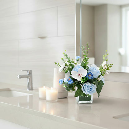 Blue artificial orchid and rose floral arrangement with eucalyptus for bathroom vanity styling
