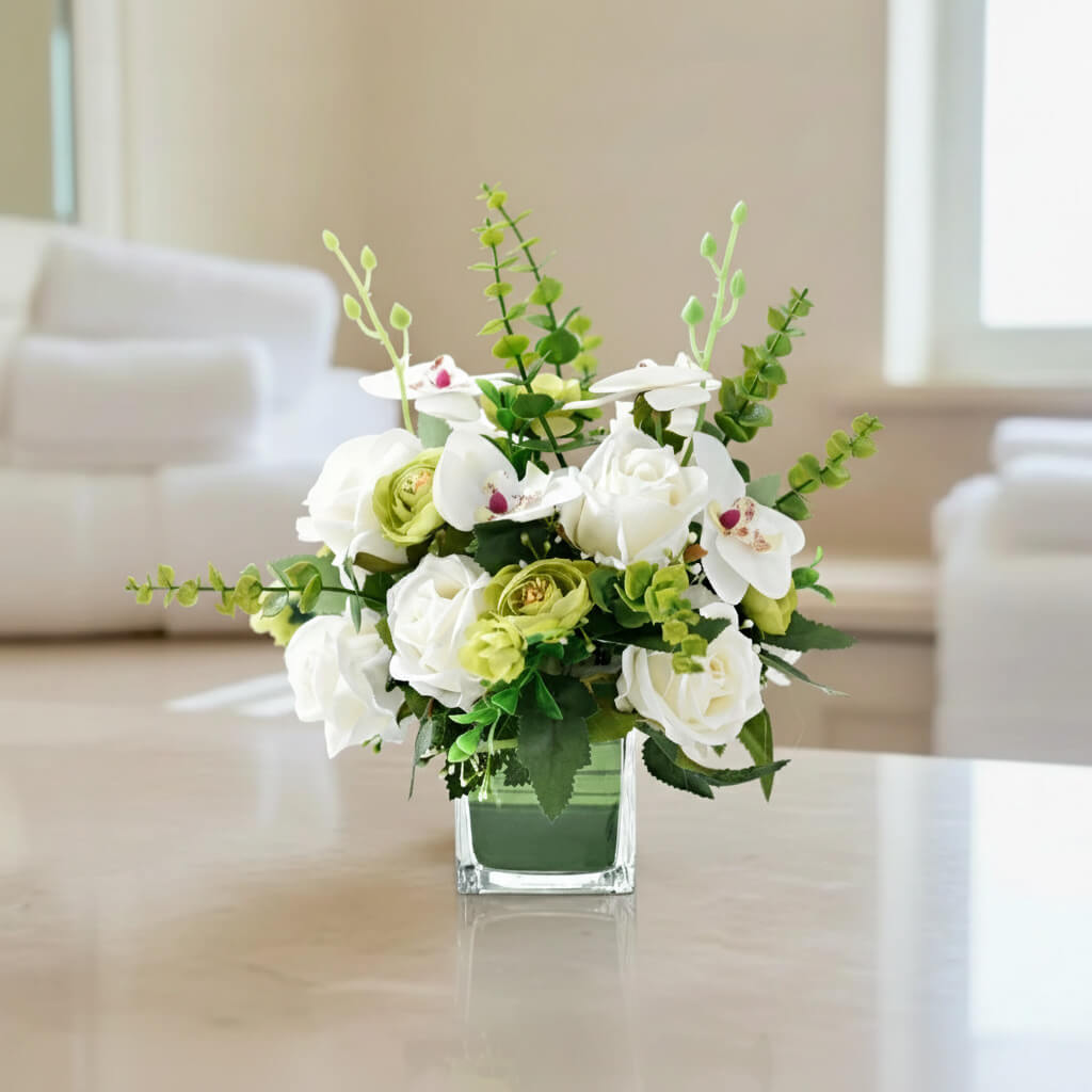 White faux orchid and rose centerpiece with eucalyptus, perfect for tabletop decor