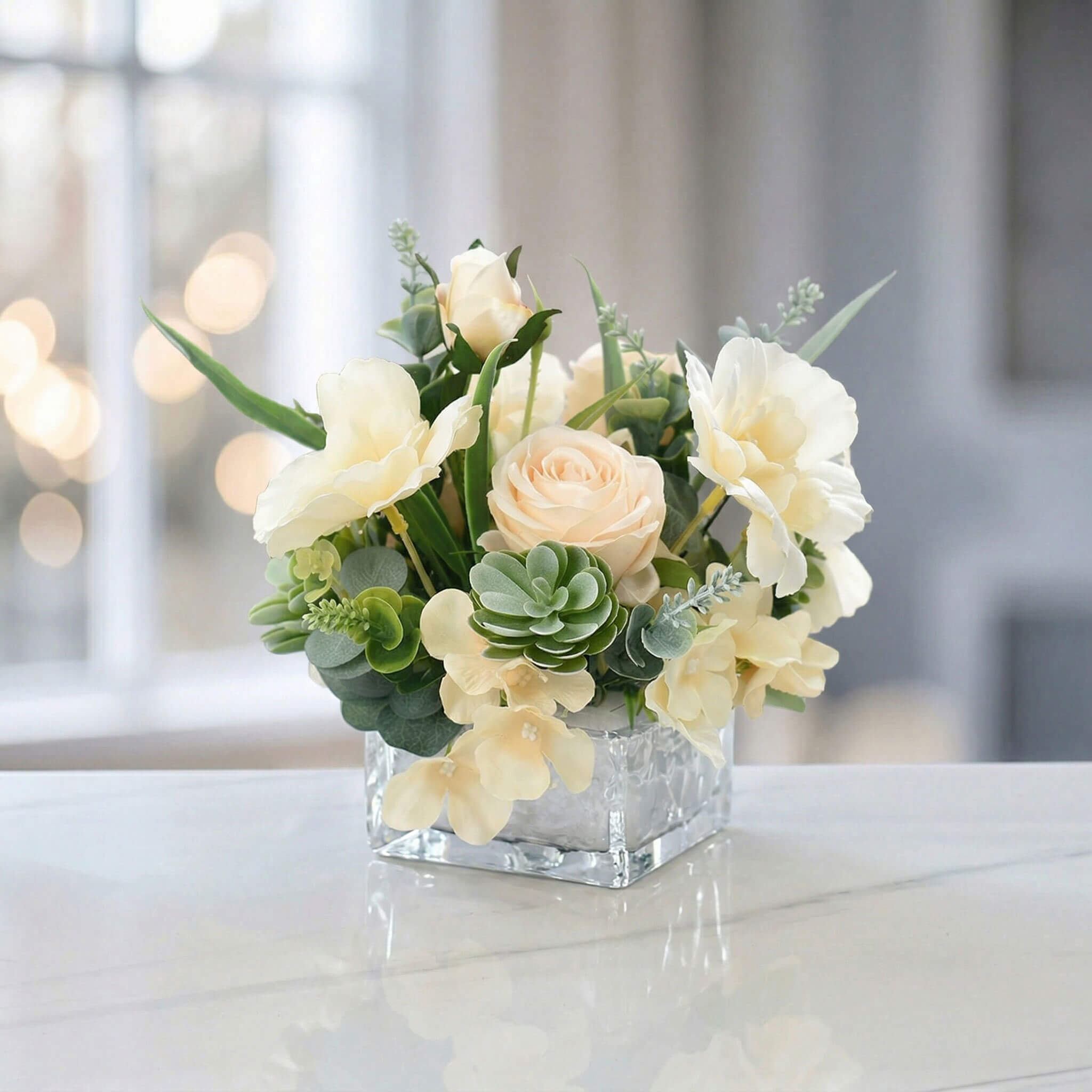 Champagne faux rose and hydrangea flower centerpiece with succulent