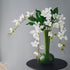 Real touch artificial jasmine arrangement in an olive green long-necked vase, elegant floral decor for modern home interiors.