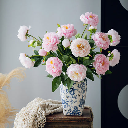 Real touch faux peony arrangement featuring soft pink blooms displayed in a classic blue and white porcelain vase, 20 inches tall