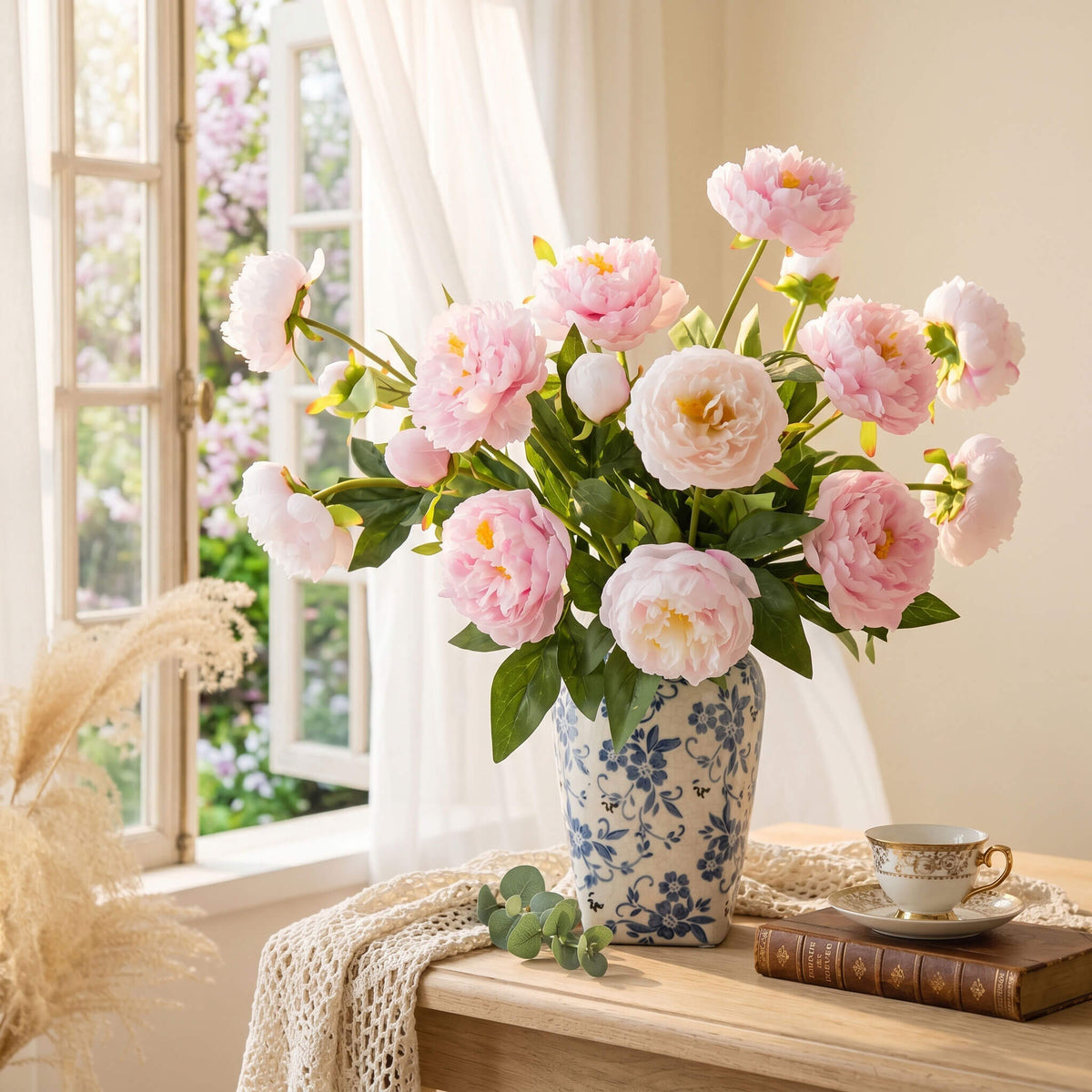 Real touch peony floral arrangement placed beside a bedroom window, bringing soft color and timeless elegance to the relaxing interior.