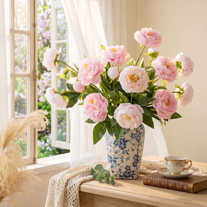 Real touch peony floral arrangement placed beside a bedroom window, bringing soft color and timeless elegance to the relaxing interior.