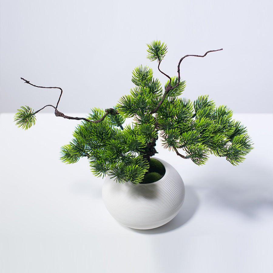 Close-up of realistic artificial pine needles showing detailed texture and natural green tones