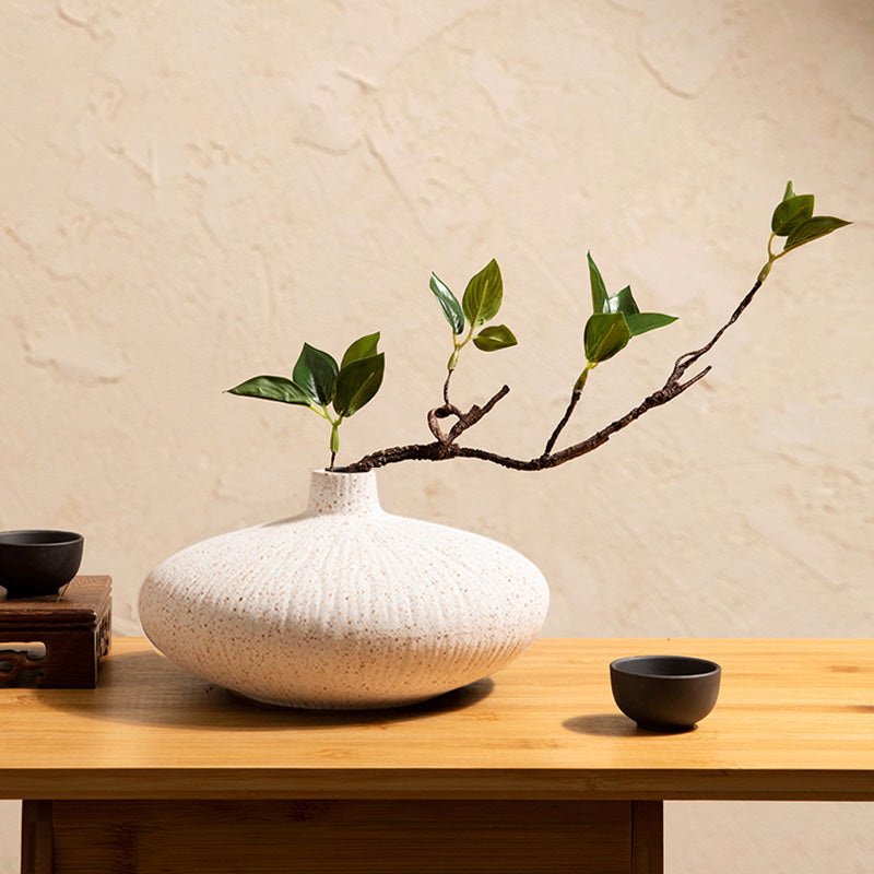 Fake ficus plant in white ceramic vase designed for modern minimalist home decor