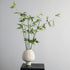 Zen artificial bamboo plant in ivory ceramic vase styled in a minimalist home corner for calm interior decor